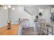 Bright dining room features a wooden table, stylish chairs, and modern light fixture at 115 Haven Brook Way, Douglasville, GA 30134