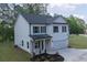 Beautiful two-story home with a covered entryway, two-car garage, and manicured lawn at 115 Haven Brook Way, Douglasville, GA 30134