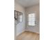 Stylish entryway with wood floors, modern mirror, and a door with blinds at 3350 Cranston Ln, Kennesaw, GA 30144