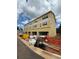 New townhouse exterior featuring yellow siding and a row of garages at 3350 Cranston Ln, Kennesaw, GA 30144