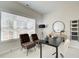 Bright home office with a modern desk, stylish chairs, and ample natural light at 3350 Cranston Ln, Kennesaw, GA 30144