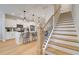 Kitchen with pendant lights, a staircase, stainless appliances, and island seating at 3350 Cranston Ln, Kennesaw, GA 30144