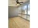 Relaxing screened porch boasts wood flooring, a ceiling fan, and views of the outdoors at 3350 Cranston Ln, Kennesaw, GA 30144