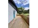 Side angle view of the back deck with ample light on a charming painted brick house at 3640 Narron Dr, Atlanta, GA 30331