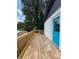 New back deck leading to a bright blue door and a charming painted brick house at 3640 Narron Dr, Atlanta, GA 30331