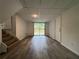 Bright basement with a sliding glass door and wood-look floors at 3640 Narron Dr, Atlanta, GA 30331
