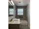 Renovated bathroom with new gray tile shower, modern vanity, and upgraded fixtures at 3640 Narron Dr, Atlanta, GA 30331