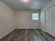 Bright bedroom with wood-look floors, closet, and a window at 3640 Narron Dr, Atlanta, GA 30331