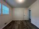 Bright bedroom features stylish wood-look floors and a window at 3640 Narron Dr, Atlanta, GA 30331