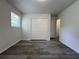 Bedroom with wood-look floors, closet, and bright window at 3640 Narron Dr, Atlanta, GA 30331