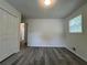 Bedroom with stylish wood-look floors, a large closet, and a window at 3640 Narron Dr, Atlanta, GA 30331