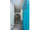 Entryway with view to open-concept kitchen featuring grey floors, white cabinets, stainless steel appliances, and island at 3640 Narron Dr, Atlanta, GA 30331