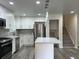 Modern kitchen features stainless steel appliances, white cabinets, and a stylish backsplash at 3640 Narron Dr, Atlanta, GA 30331