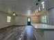 Open-concept living area with hardwood floors, lots of natural light, and modern light fixtures at 3640 Narron Dr, Atlanta, GA 30331