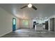 Spacious living room open to modern kitchen with grey floors and plenty of natural light creating a welcoming space at 3640 Narron Dr, Atlanta, GA 30331