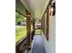 Covered front porch with dark grey floor, metal railing, and decorative lighting perfect for relaxing outdoors at 3640 Narron Dr, Atlanta, GA 30331