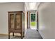 Finished basement with a small cabinet and an exterior walkout door at 4950 Creel Rd, Chattahoochee Hills, GA 30213