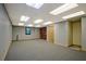 Spacious basement featuring neutral walls, carpeted floor, and fluorescent lighting at 4950 Creel Rd, Chattahoochee Hills, GA 30213
