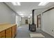 Large basement area with vintage stove, storage counter, and multiple doors at 4950 Creel Rd, Chattahoochee Hills, GA 30213