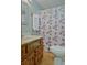 Bathroom featuring a wooden vanity and a shower with a patterned curtain at 4950 Creel Rd, Chattahoochee Hills, GA 30213