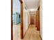 Hallway leading to various rooms with wood trim at 4950 Creel Rd, Chattahoochee Hills, GA 30213