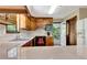 Bright kitchen with wood cabinets, stainless appliances, and deck access at 4950 Creel Rd, Chattahoochee Hills, GA 30213