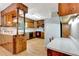 The kitchen features wood cabinets, a breakfast bar, and white countertops at 4950 Creel Rd, Chattahoochee Hills, GA 30213