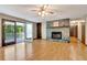 Hardwood floors, fireplace and access to the outside deck are highlights of this great room at 4950 Creel Rd, Chattahoochee Hills, GA 30213
