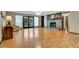 Spacious living room features hardwood floors, a stone fireplace, and glass doors leading to the balcony at 4950 Creel Rd, Chattahoochee Hills, GA 30213
