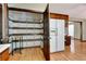 Walk-in pantry with ample shelving next to the refrigerator at 4950 Creel Rd, Chattahoochee Hills, GA 30213