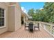 Spacious back deck with outdoor furniture and a beautiful view of the trees and the yard at 5105 Deerlake Dr, Alpharetta, GA 30005