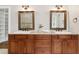 This bathroom features a double vanity, granite countertops, and dark wood cabinets at 5105 Deerlake Dr, Alpharetta, GA 30005