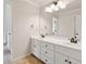 Bathroom with double vanity, modern fixtures, and neutral decor at 5105 Deerlake Dr, Alpharetta, GA 30005