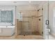 This bathroom features a stand alone shower with tile surround and a soaking tub at 5105 Deerlake Dr, Alpharetta, GA 30005
