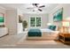 Staged bedroom featuring a plush bed, stylish decor, and a double window at 5105 Deerlake Dr, Alpharetta, GA 30005