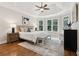 Spacious bedroom with tray ceilings and abundant natural light, creating a serene retreat at 5105 Deerlake Dr, Alpharetta, GA 30005