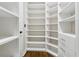 The walk-in closet features built in shelving and drawers at 5105 Deerlake Dr, Alpharetta, GA 30005