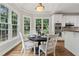 Bright dining area features large windows, ideal for meals with a view at 5105 Deerlake Dr, Alpharetta, GA 30005