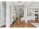 Spacious foyer with hardwood floors, soaring ceilings, decorative pillars, and access to the staircase at 5105 Deerlake Dr, Alpharetta, GA 30005