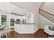 An open-concept kitchen features stainless steel appliances and ample counter space, ideal for entertaining at 5105 Deerlake Dr, Alpharetta, GA 30005