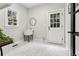 Stylish mud room with charming patterned tile floor and natural light at 5105 Deerlake Dr, Alpharetta, GA 30005