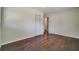 Bedroom with hardwood floors and closet, showcasing a simple, bright space at 606 Evergreen Dr, Woodstock, GA 30188