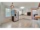 Bright kitchen featuring white cabinets, tile flooring, and stainless steel refrigerator at 606 Evergreen Dr, Woodstock, GA 30188