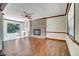 Living room featuring a brick fireplace, built-in shelving, and sliding glass doors at 606 Evergreen Dr, Woodstock, GA 30188