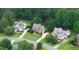Aerial view of multiple residences with manicured lawns in a desirable neighborhood at 161 Highgrove Dr, Suwanee, GA 30024