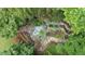 Overhead view of backyard landscaping and water feature at 161 Highgrove Dr, Suwanee, GA 30024