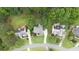 Aerial view of multiple residential homes showcasing their manicured lawns and well-kept exteriors at 161 Highgrove Dr, Suwanee, GA 30024