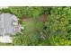 Aerial view of the property showcasing mature trees and a well-manicured lawn at 161 Highgrove Dr, Suwanee, GA 30024
