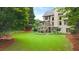 Expansive backyard with lush lawn and mature trees, offering plenty of space for outdoor activities and entertaining at 161 Highgrove Dr, Suwanee, GA 30024