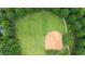 Aerial view of community baseball field bordered by green trees and a walking path, ideal for outdoor recreation at 161 Highgrove Dr, Suwanee, GA 30024